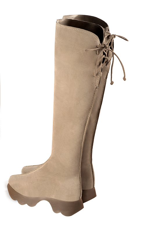 Biscuit beige women's knee-high boots, with laces at the back. Round toe. Low rubber soles. Made to measure. Rear view - Florence KOOIJMAN